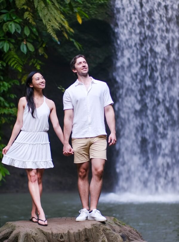 Ubud jungle waterfall and Balinese water temple with lush rice terraces